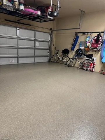 2 car garage with upgraded epoxy floor covering