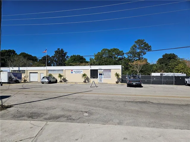 View of commercial location with uncovered parking