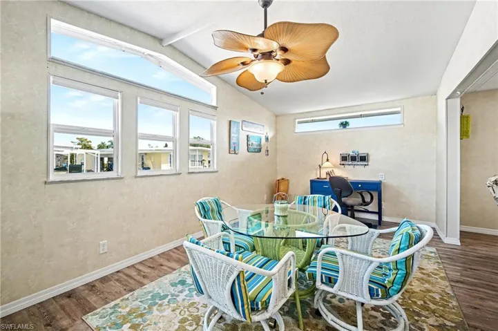 Dining space featuring wood finished floors and a ceiling fan