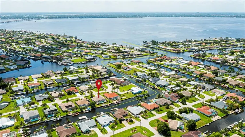 Waterfront residential neighborhood featuring canals and direct access to a large body of water