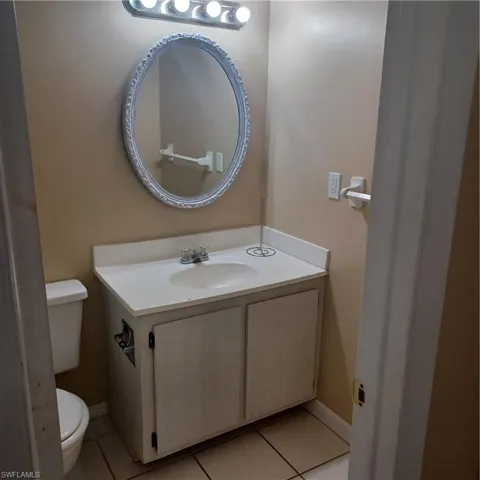 Bathroom with vanity and tile patterned flooring