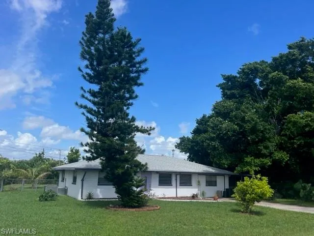 View of front of property with a front lawn