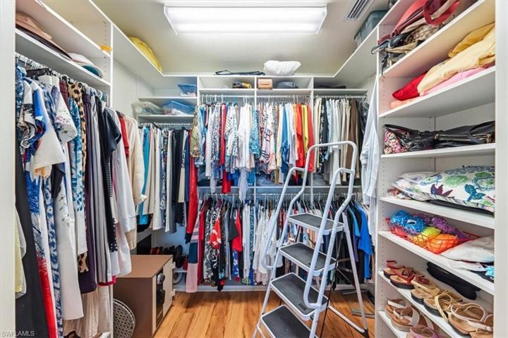 Primary Closet w/ custom built in shelving
