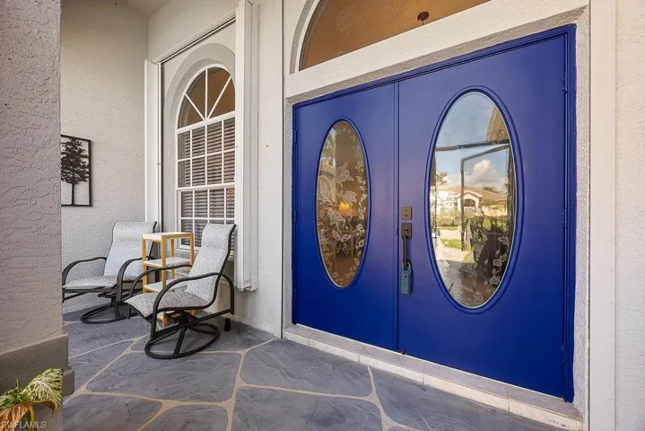 Entrance to property featuring stucco siding