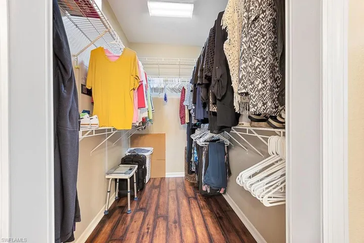 Spacious closet featuring wood finished floors