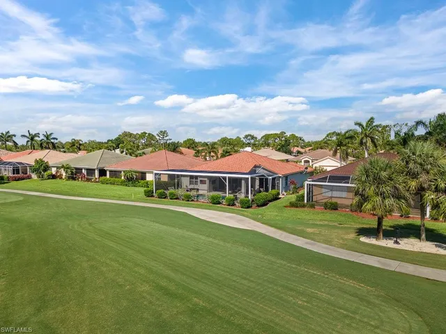 View of home's community with a yard, golf course view, and a residential view