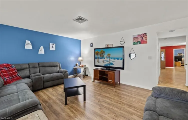 Living room with wood-type flooring