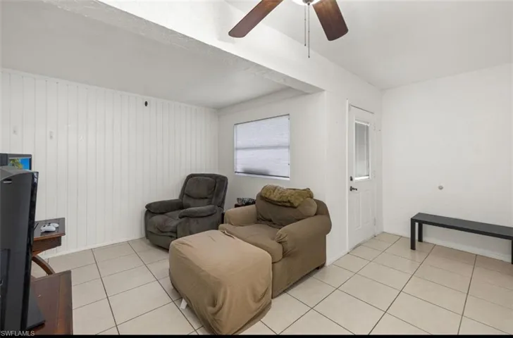 Tiled living room with ceiling fan