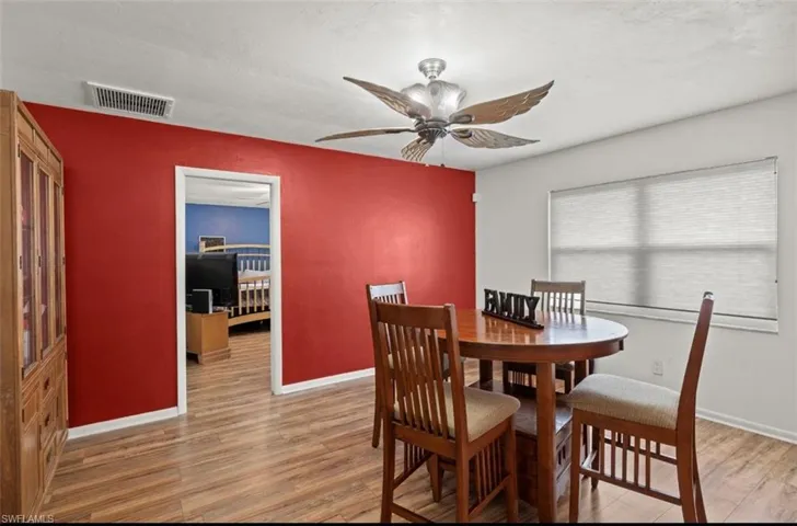 Dining room featuring hardwood / wood-style flooring and ceiling fan