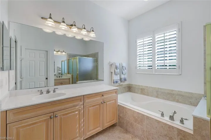 AI Generated Photo of primary bathroom with dual vanity with separate tub and shower