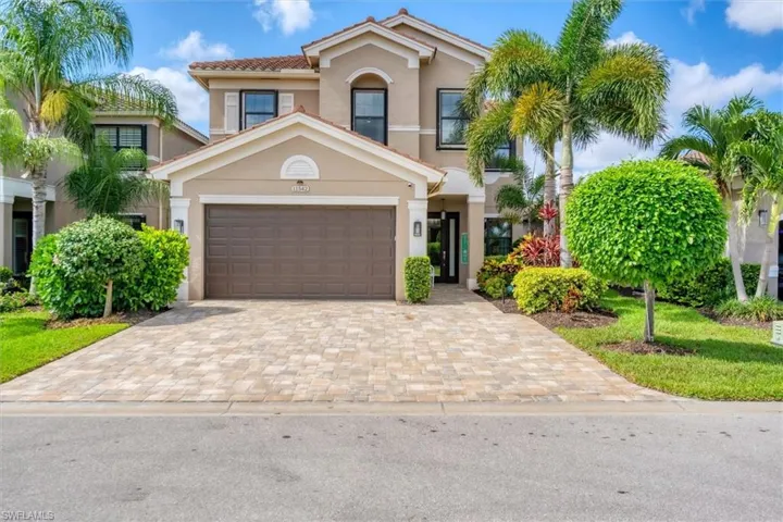 Mediterranean / spanish-style house with a garage