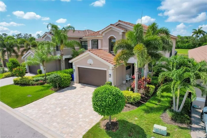 Mediterranean / spanish home with a garage
