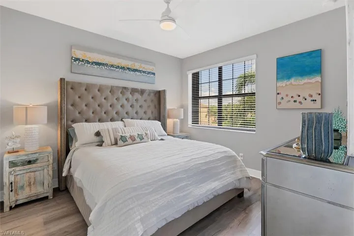 Bedroom featuring ceiling fan and light hardwood / wood-style flooring