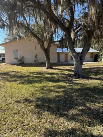 View of front of property featuring a front lawn