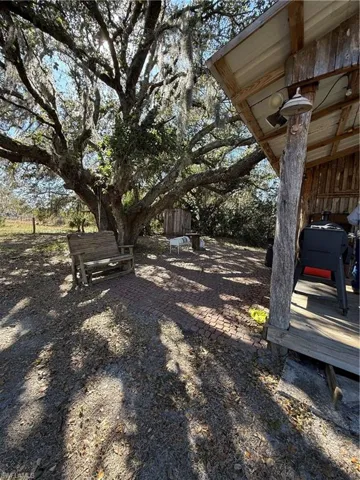View of yard with a wooden deck