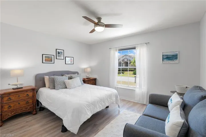 Bedroom featuring wood finished floors and a ceiling fan