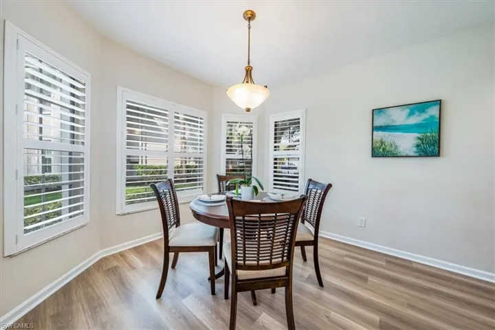 Dining area with light wood-type flooring
