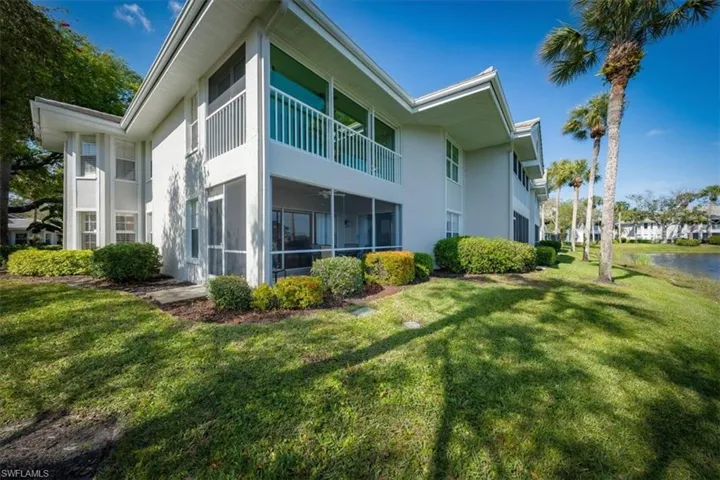 View of side of home featuring a yard