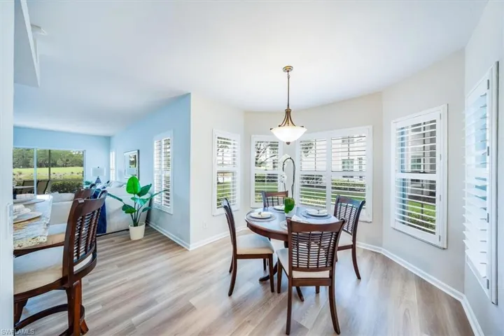 Dining area with plenty of natural light and light hardwood / wood-style flooring