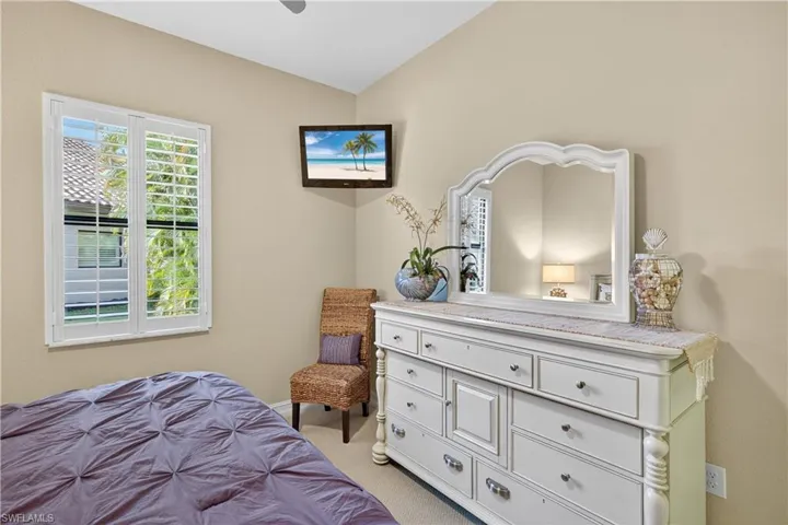 Carpeted 3rd Guest Bedroom Featuring, Mounted TV, and Plantation Shutters