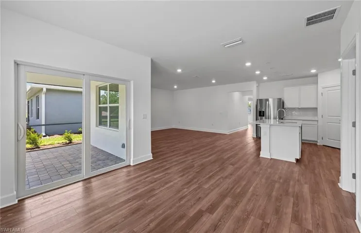 Sliding glass door onto screened lanai - Interior photos of home - Updated 8/7/24
