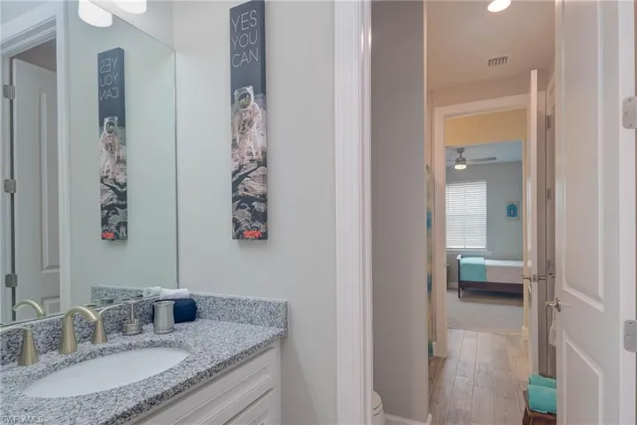 Bathroom featuring hardwood / wood-style floors and vanity