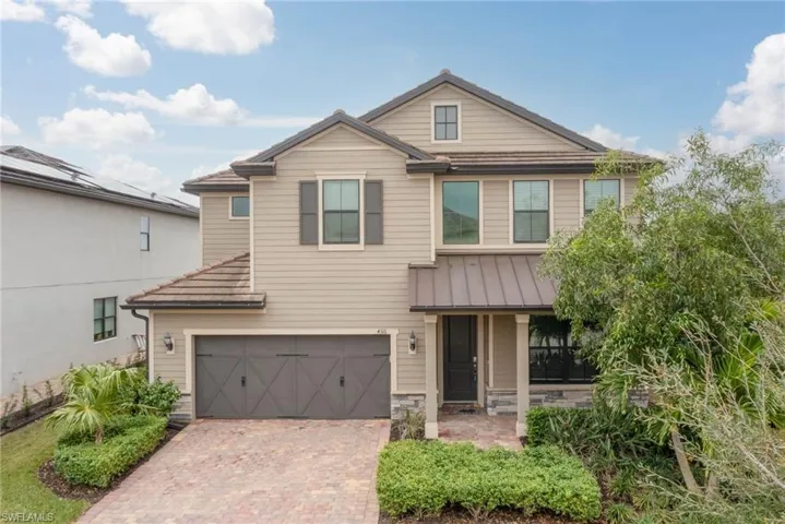 View of front of property with a garage