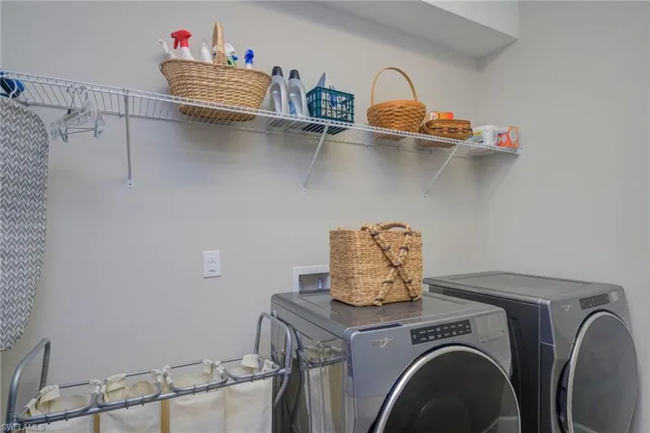 Laundry area featuring washing machine and clothes dryer