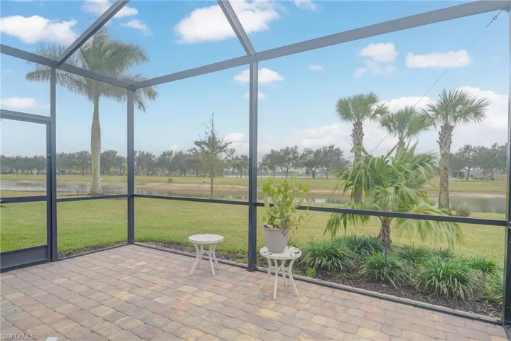 Unfurnished sunroom featuring a water view