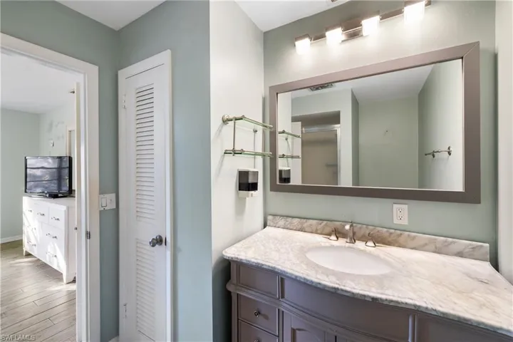 Primary bathroom vanity and linen closet