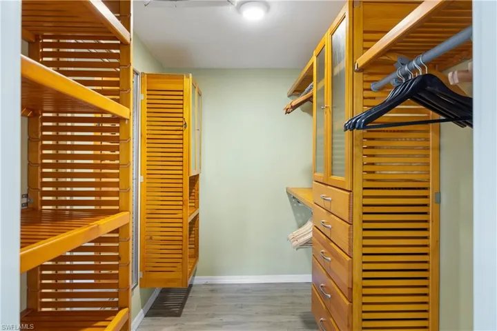 Primary "California" closet with tons of storage and large mirror