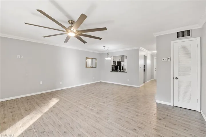 View of living room and dining room from the master bedroom door