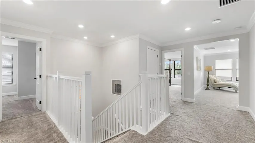 Upstairs Hallway leading to all bedrooms, full hall bath and Laundry Room