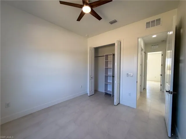 bedroom featuring a closet and ceiling fan