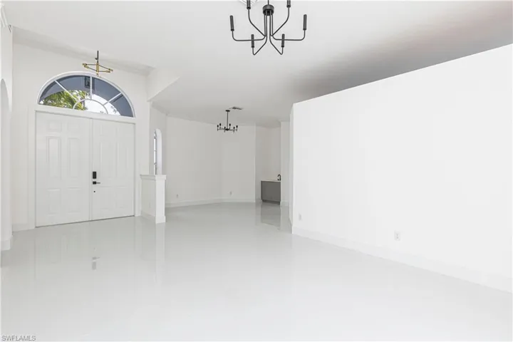 Entrance foyer featuring light tile patterned flooring