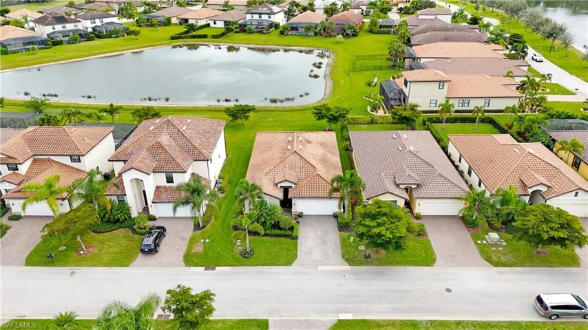 Aerial perspective of suburban area with a large body of water