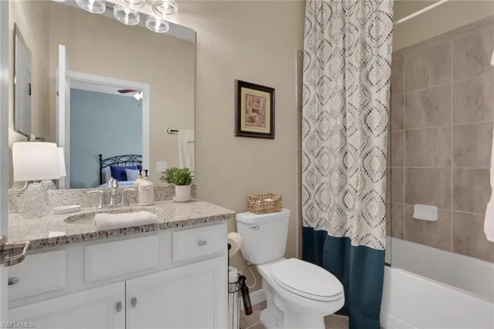 Ensuite bathroom with vanity and shower / bath combo