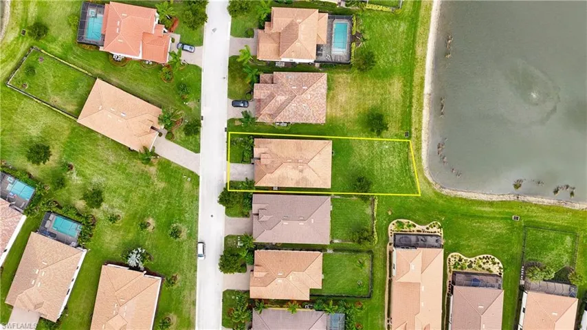 Aerial view of residential area with property boundaries highlighted