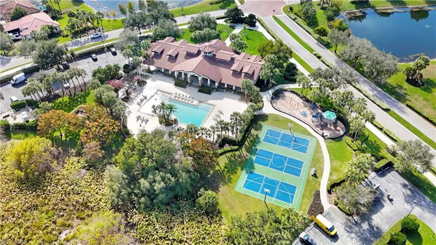 Bird's eye view of a pool area and a large body of water