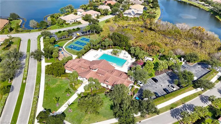 Aerial view of property's location with a large body of water