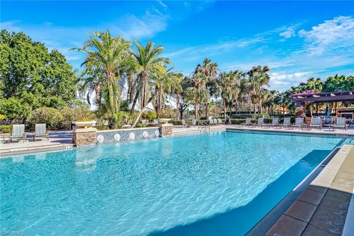 Community pool with a patio