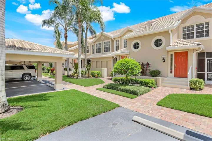 Mediterranean / spanish-style home with stucco siding, a tile roof, and a front yard