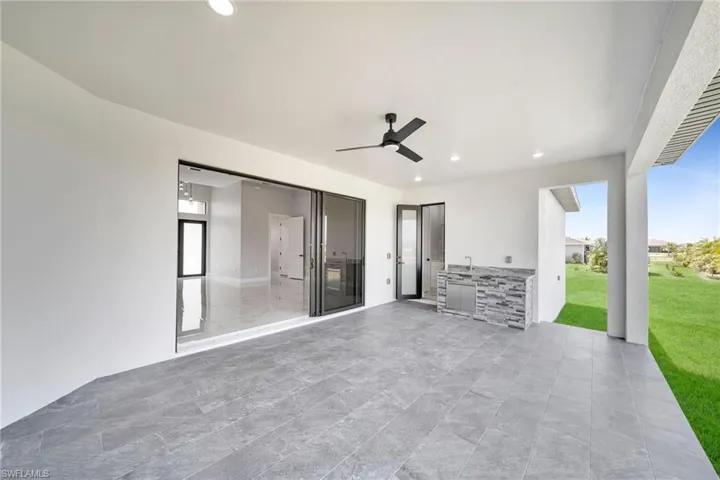 View of patio / terrace featuring exterior kitchen and ceiling fan