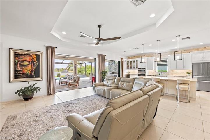 LIVING ROOM LOOKING OUT TO LANAI DOWN CANAL