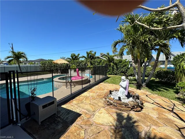 View of pool with a fenced in pool, a patio, and fence