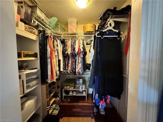 Spacious closet with wood finished floors