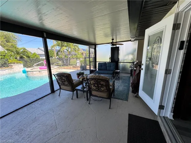 Sunroom / solarium featuring ceiling fan