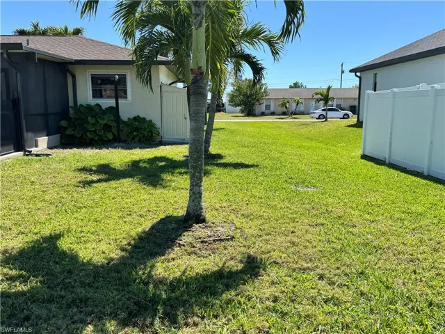 View of yard featuring fence