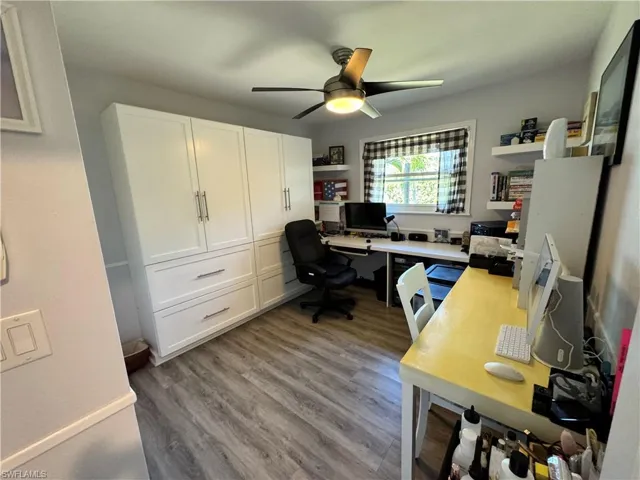Office space featuring ceiling fan and wood finished floors