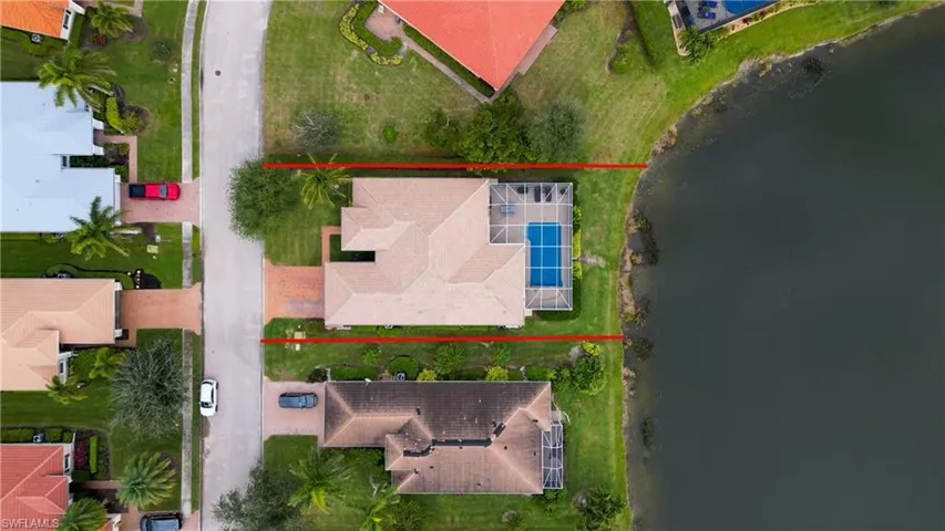 View of property location with a nearby body of water and property parcel outlined